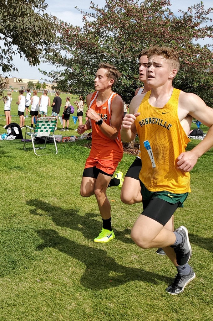 Wells High School cross country team members running in Jerome