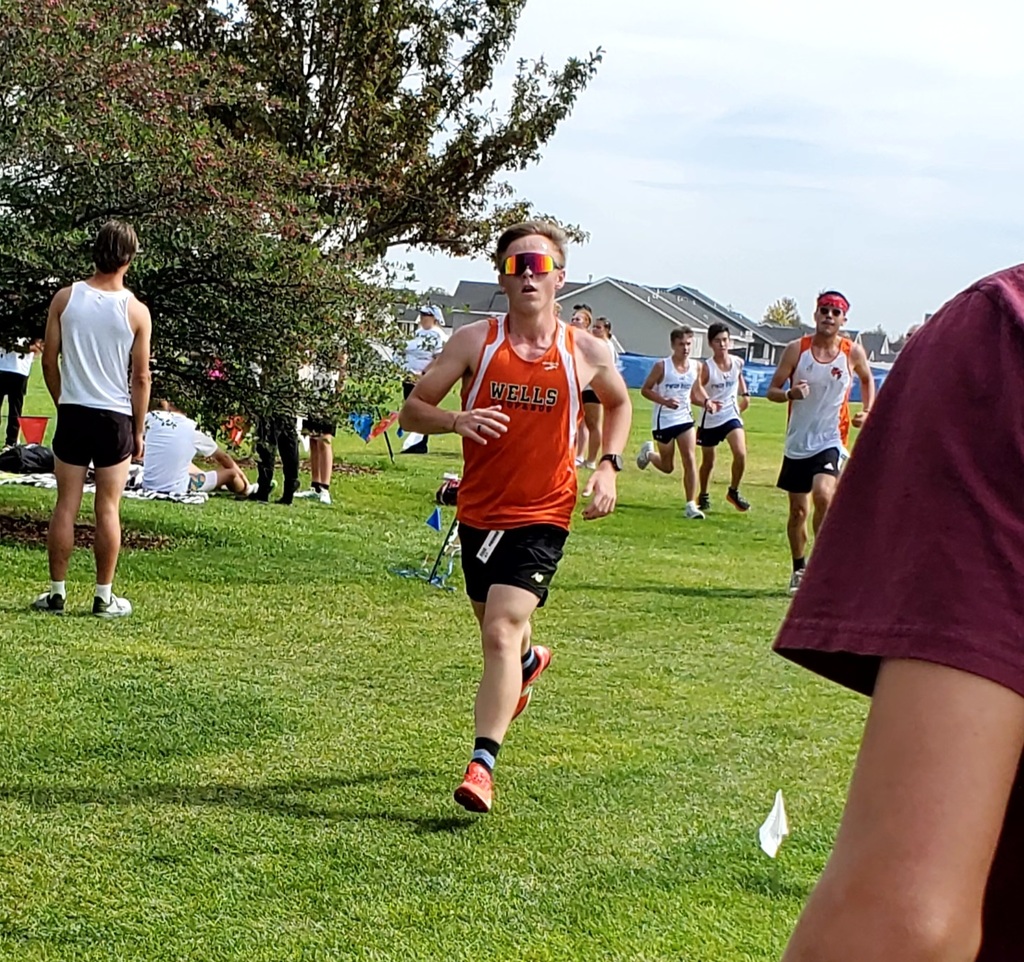Wells High School cross country team members running in Jerome