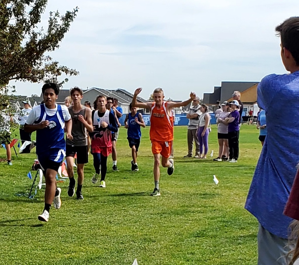 Wells High School cross country team members running in Jerome