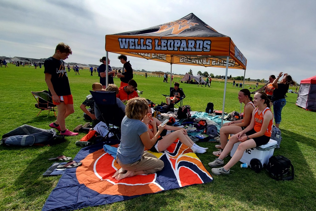 Wells High School cross country team members running in Jerome