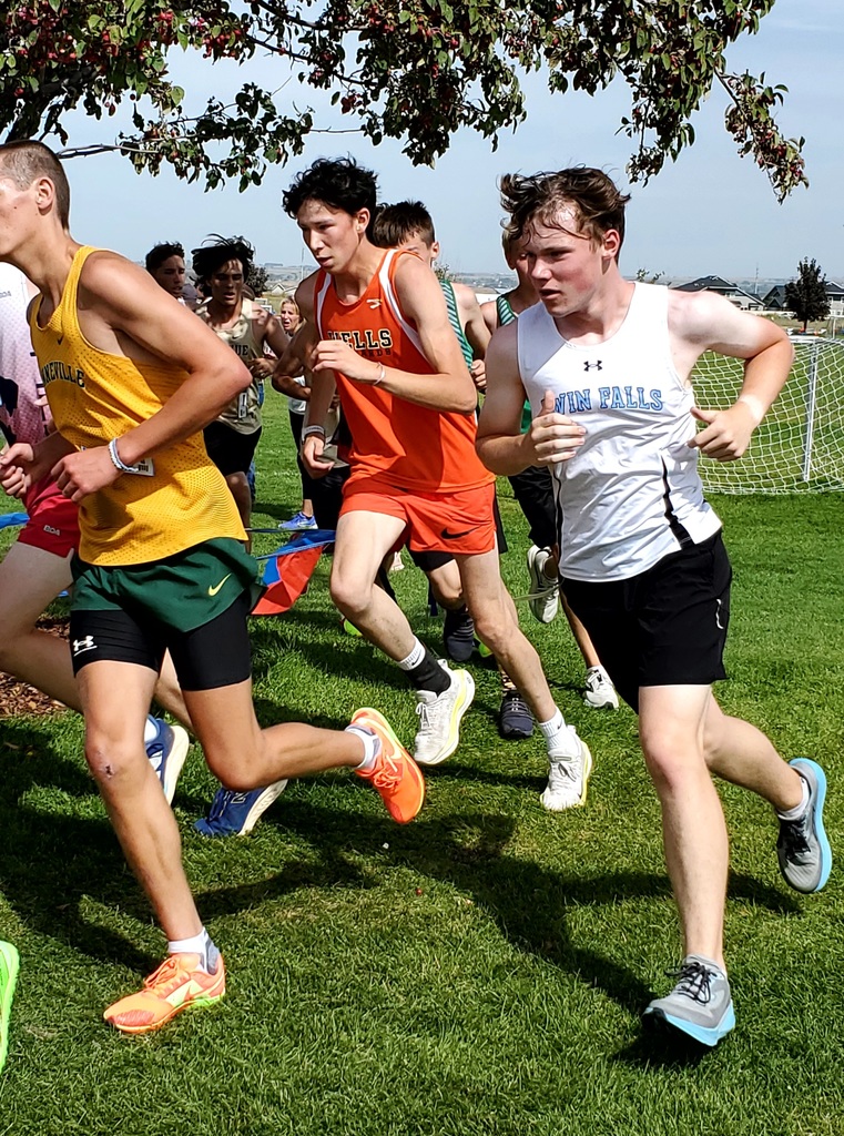 Wells High School cross country team members running in Jerome
