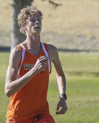 Wells athlete running at the Wells Invite