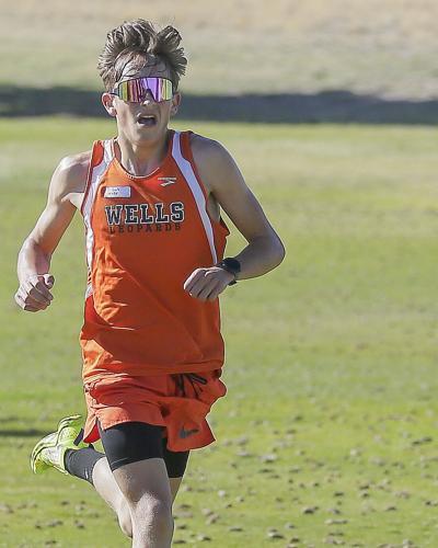 Wells althlete running at the Wells Invite