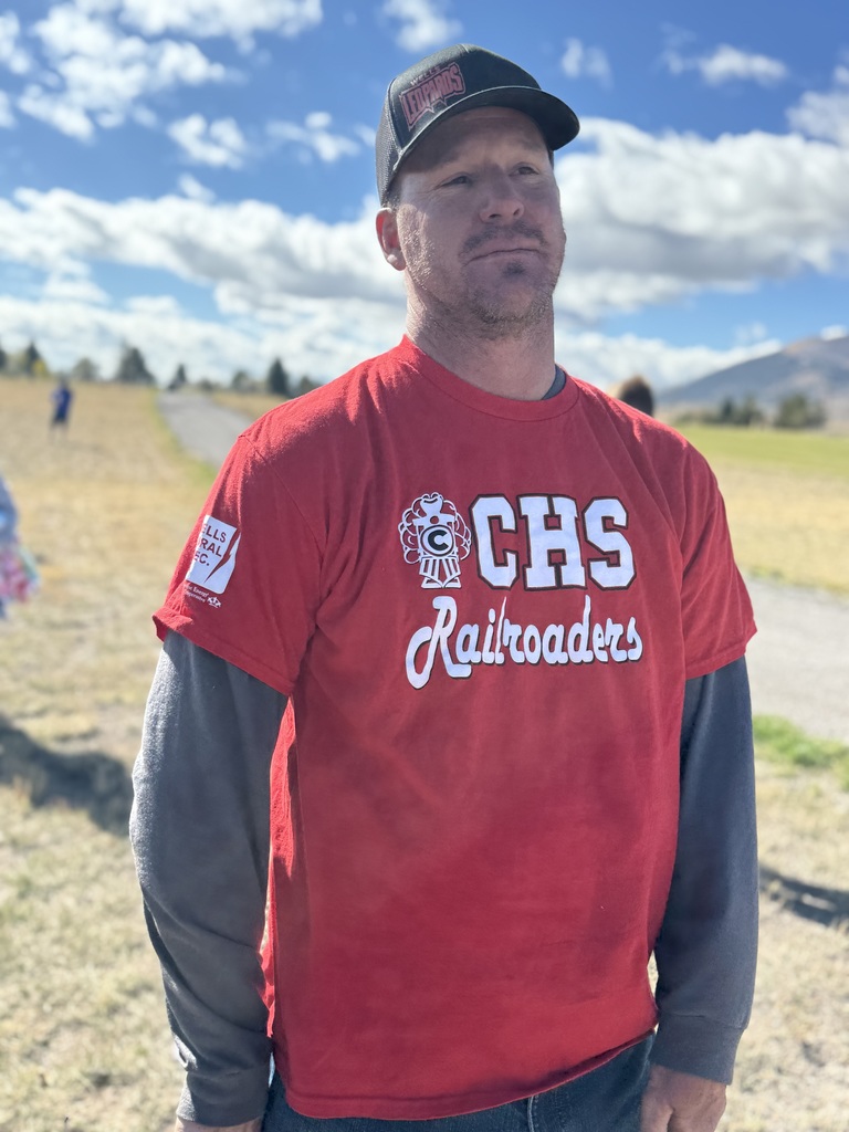 Booster Club president wearing rival team Carlins gear after the loss of a football game