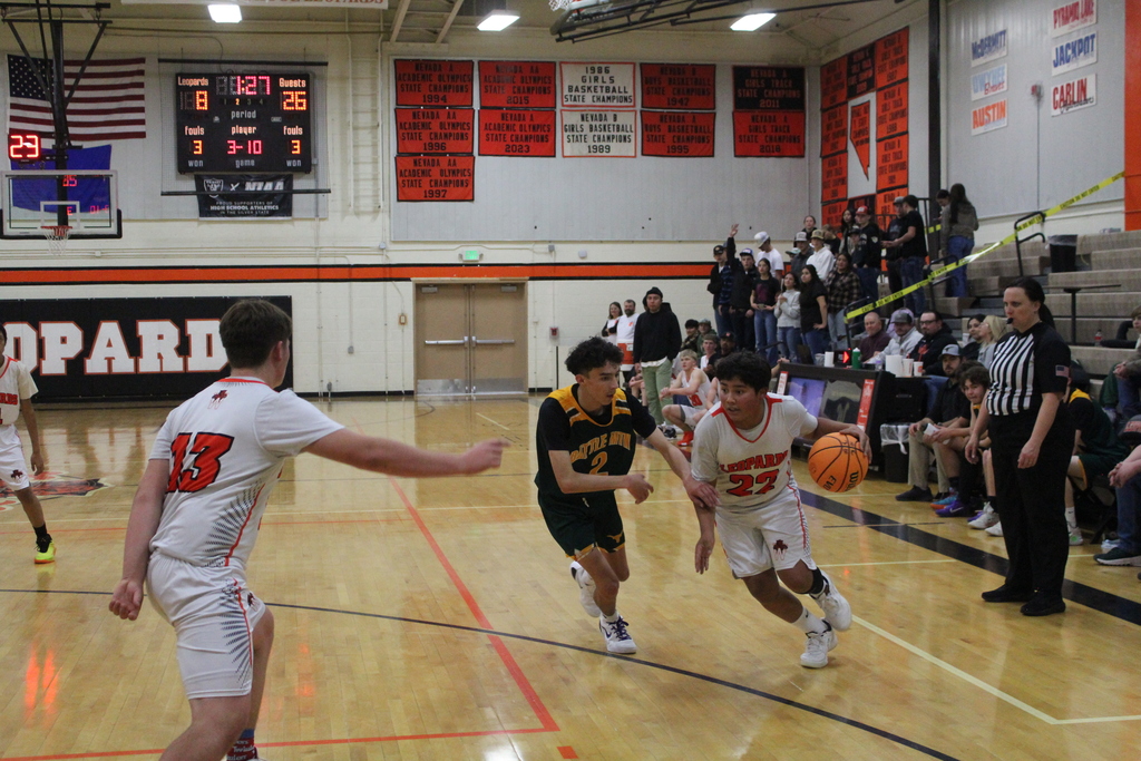 Wells JV basketball team playing Battle Mountain