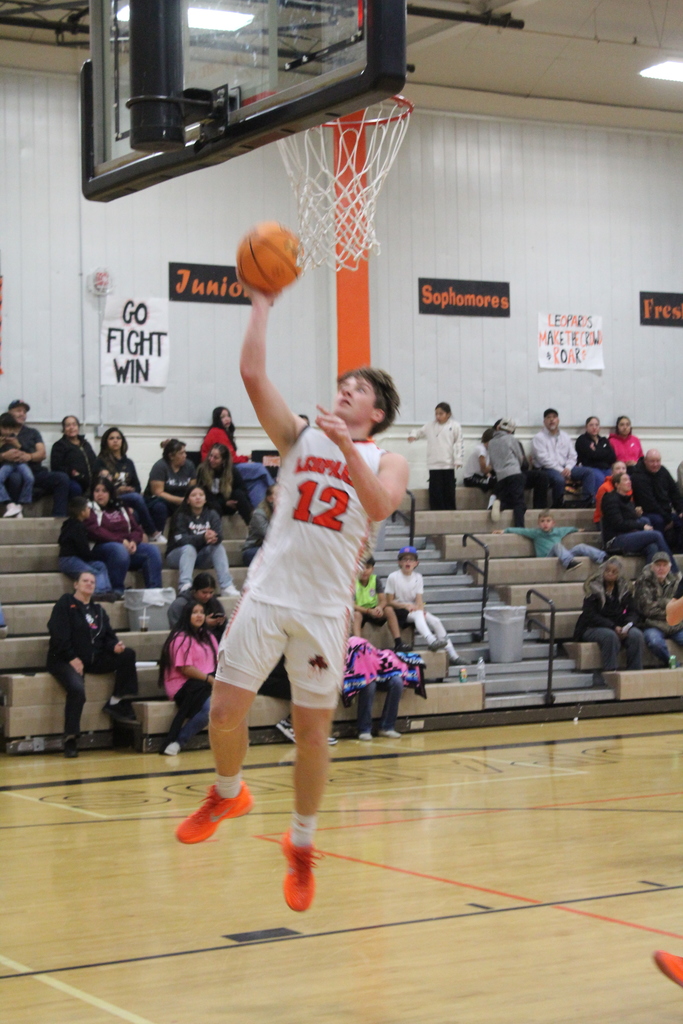 WHS boys varsity team playing basketball