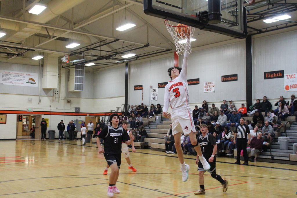 WHS boys varsity team playing basketball