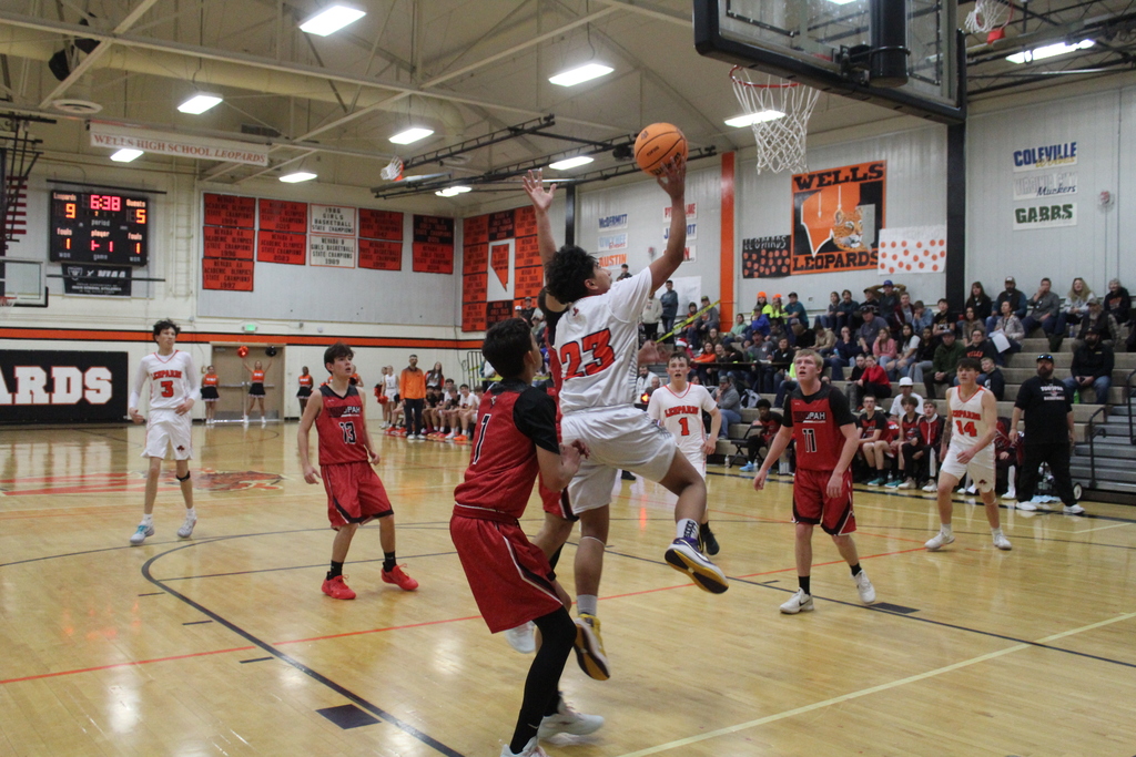 WHS boys varsity team playing basketball