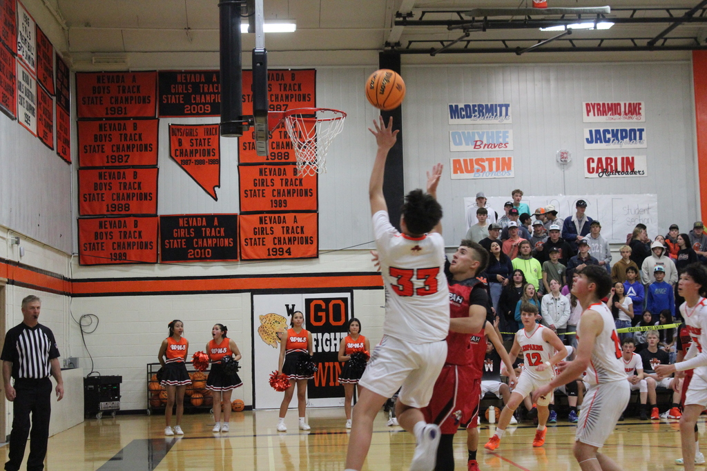 WHS boys varsity team playing basketball