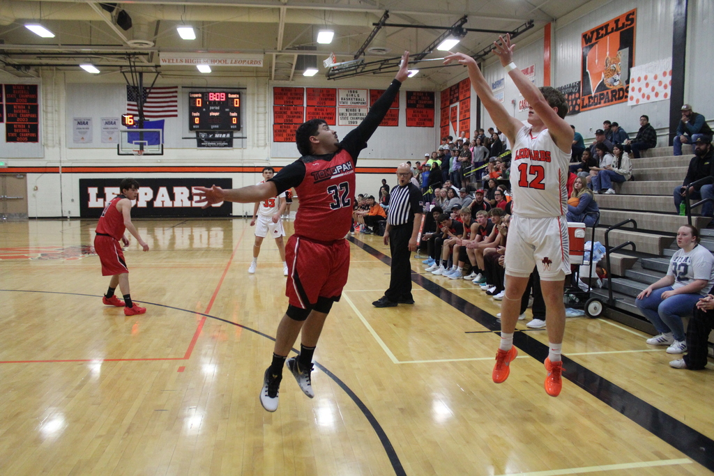 WHS boys varsity team playing basketball