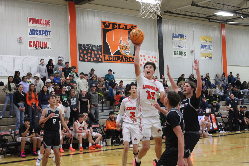 WHS boys varsity team playing basketball