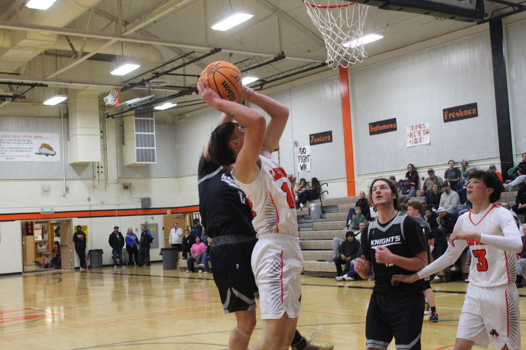 WHS boys varsity team playing basketball
