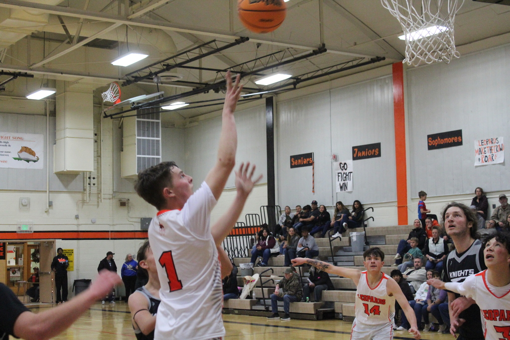 WHS boys varsity team playing basketball