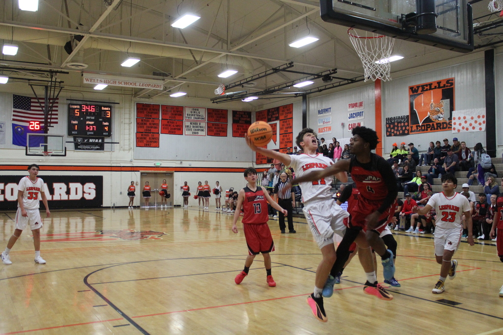 WHS boys varsity team playing basketball