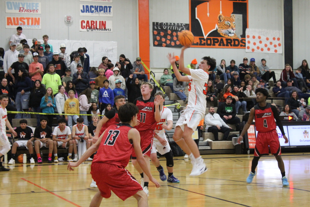 WHS boys varsity team playing basketball