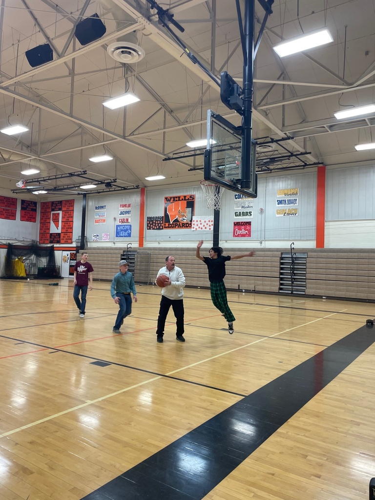 Mr. Woolsey playing basketball against students during HOPE Week