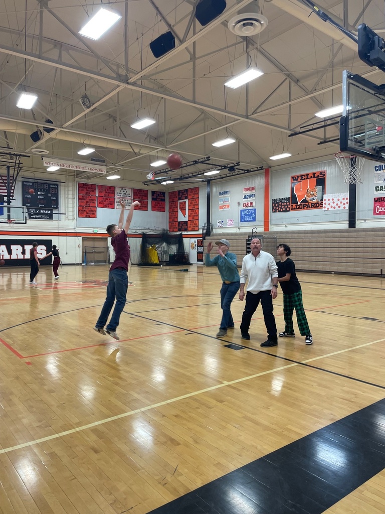 Mr. Woolsey playing basketball against students during HOPE Week