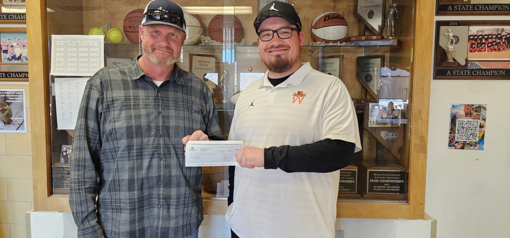 Myles B receiving a donation from Graymont