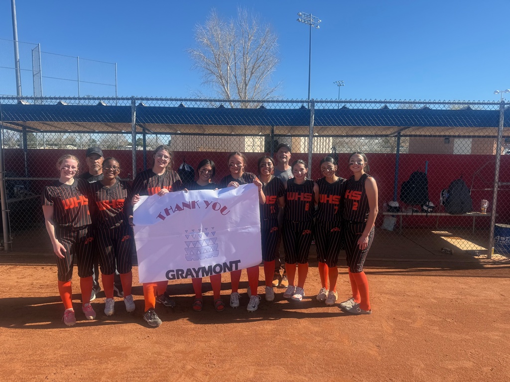 WHS team with a thank you banner