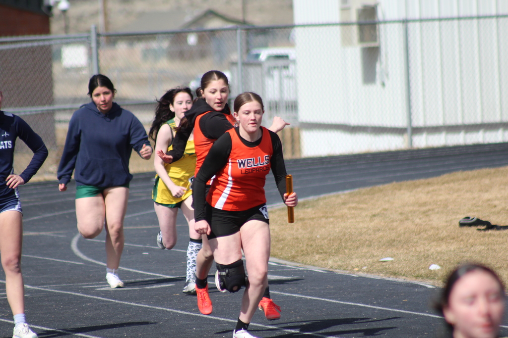 WHS track team members competing