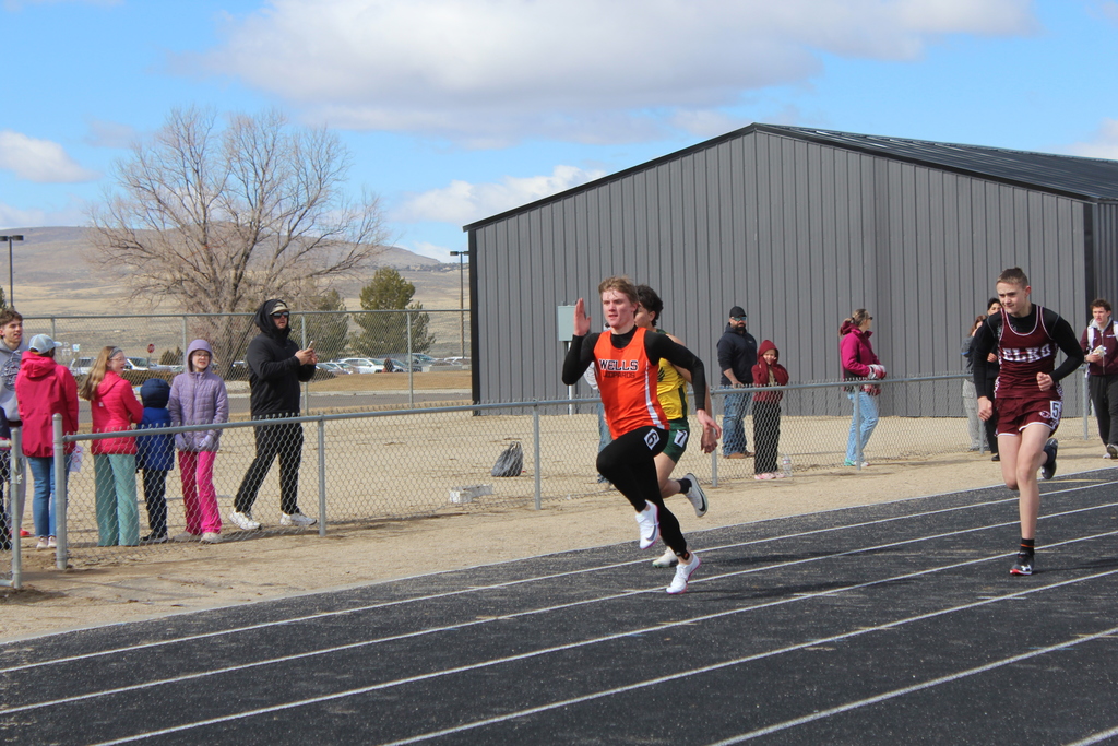 Wells High School boys track team competing