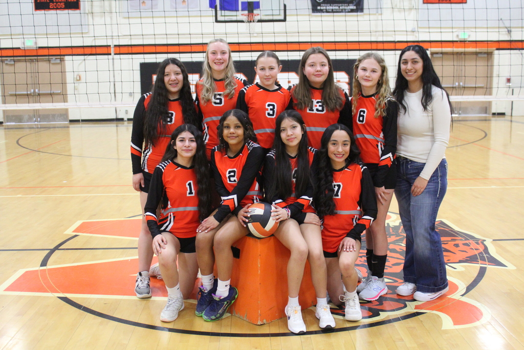Junior high volleyball team orange uniforms