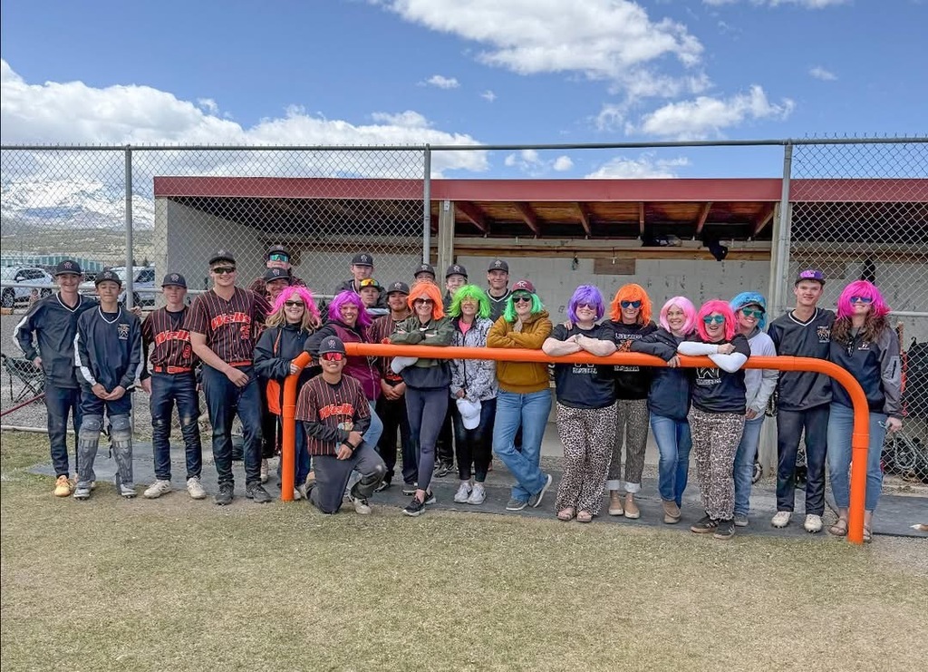 baseball team with their mom's in wigs