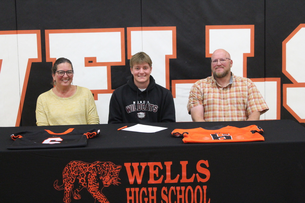 Wells High School senior signing to play football in college