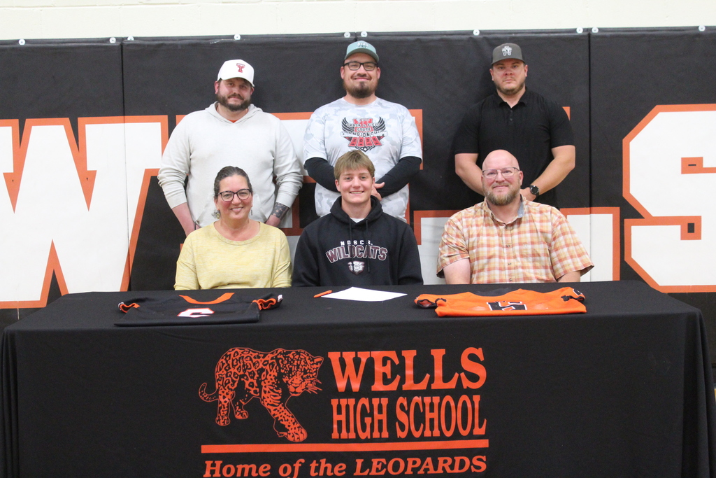 Wells High School senior signing to play football in college