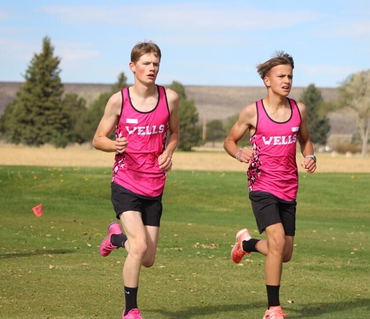 Wells cross country runners at the Wells Invitational