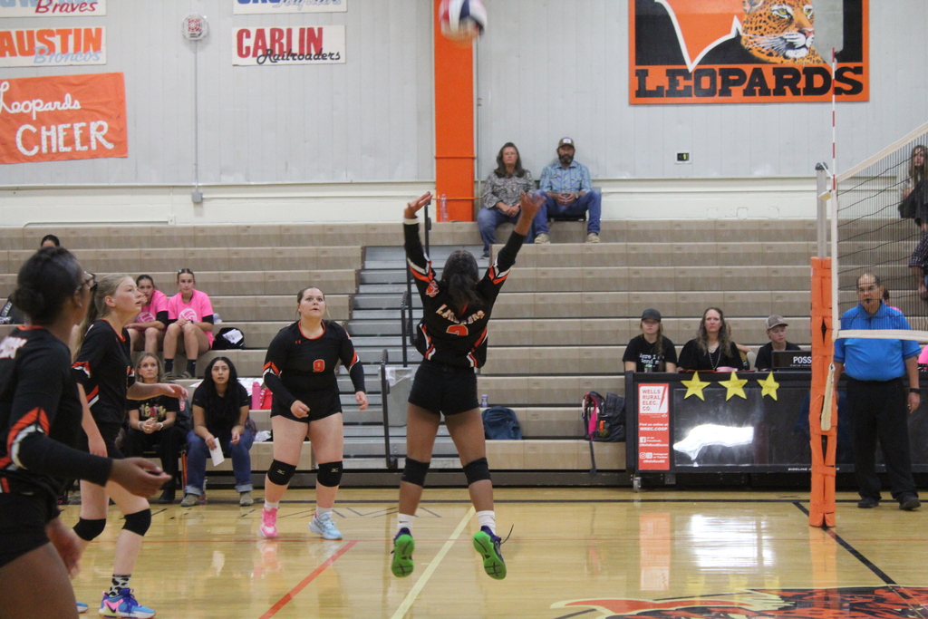 Wells JV volleyball girls playing in the gym in Wells