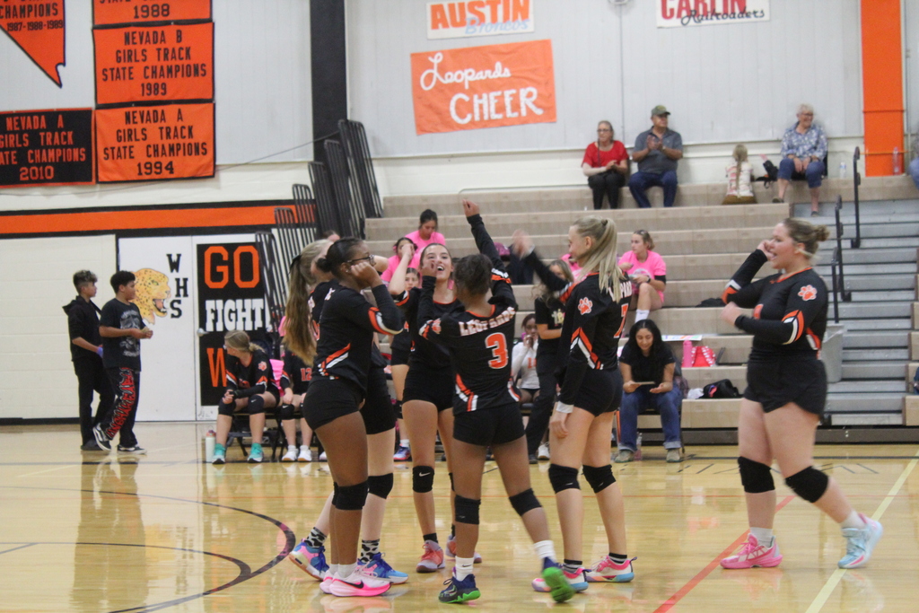 Wells JV volleyball girls playing in the gym in Wells