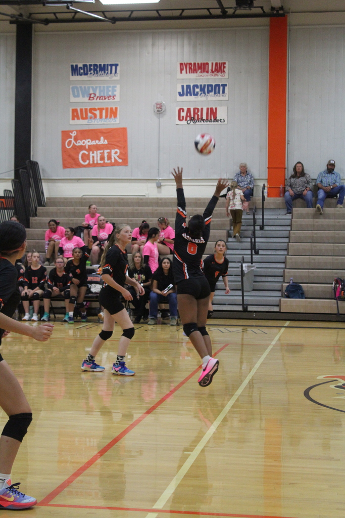 Wells JV volleyball girls playing in the gym in Wells