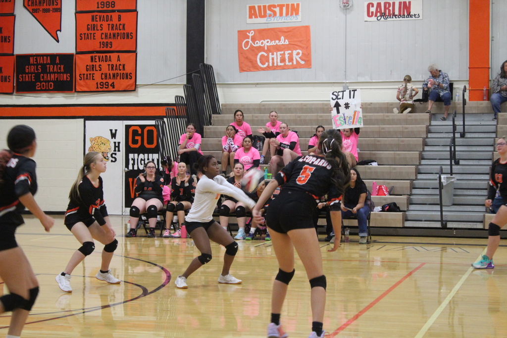 Wells JV volleyball girls playing in the gym in Wells