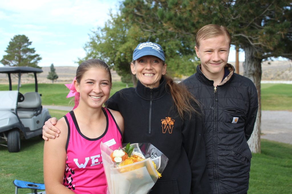 12th grade cross country runners with their families