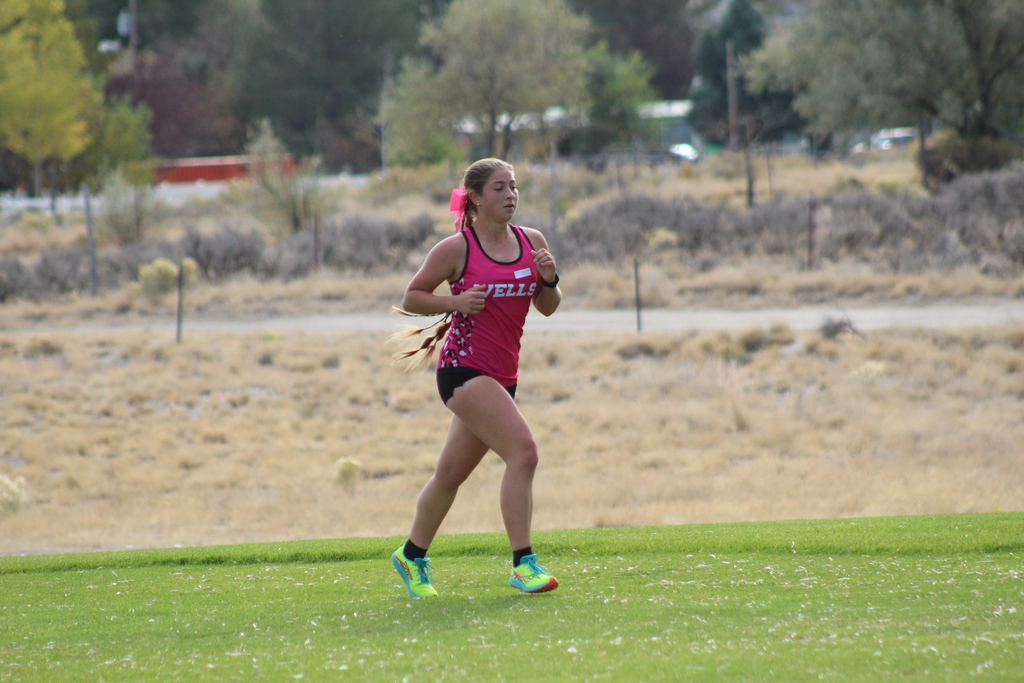 Wells High School cross country runner at the Chimney Rock Golf Course