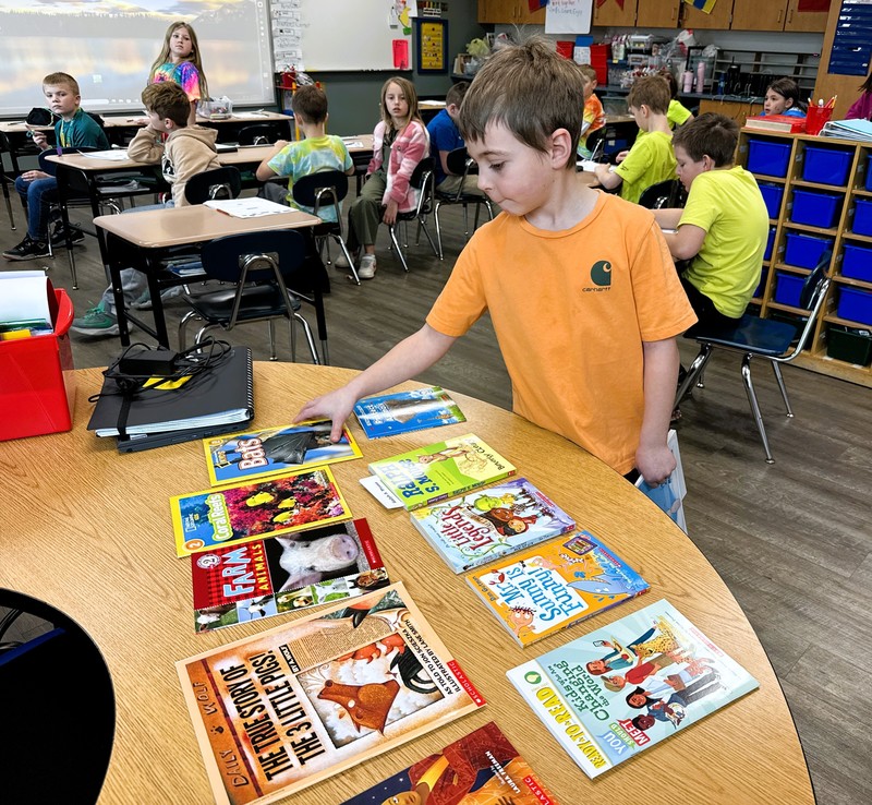 2nd gr Anton picking out book