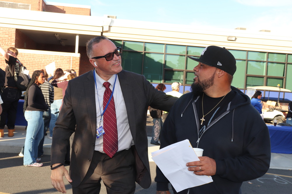 Principal Pabon greats a parent at Open House