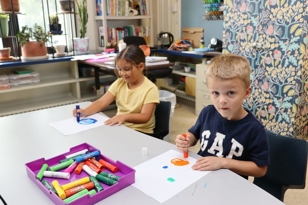 Two students working in art class