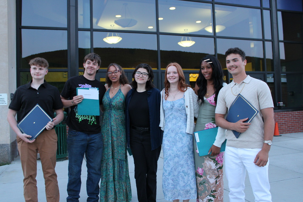 A group of seniors posing with their awards