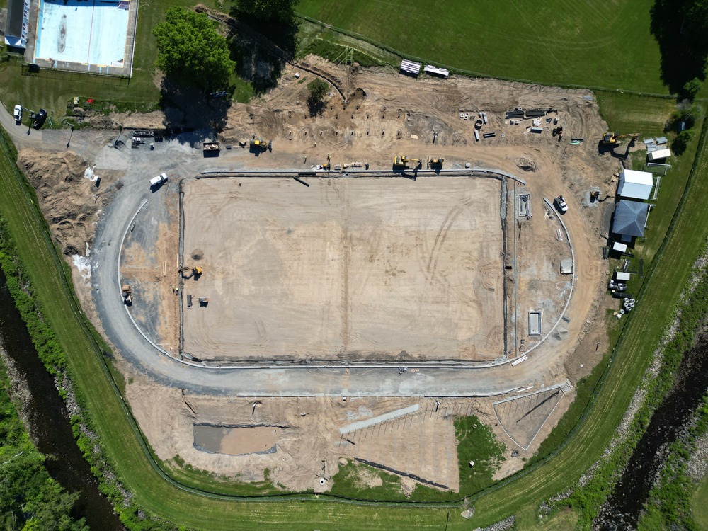 An aerial view of construction work on the track and field