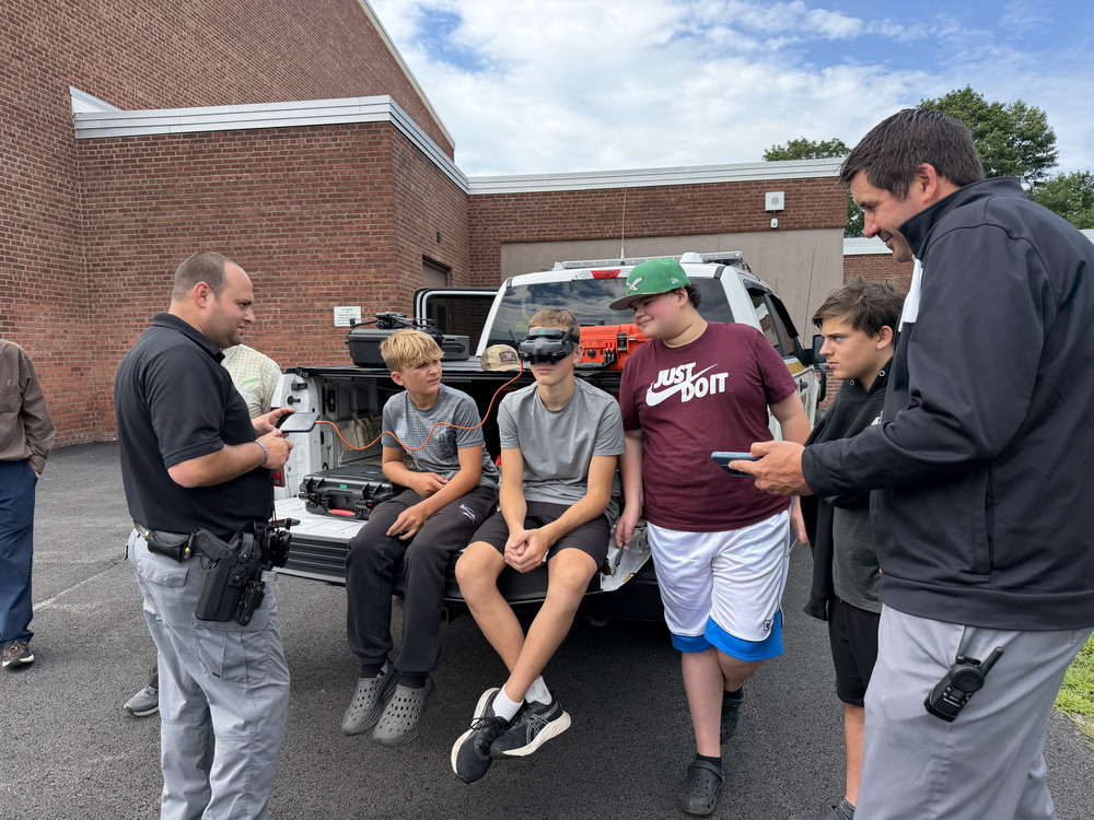 A deputy lets students try out drone equipment