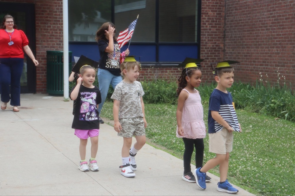 Pre-K graduates walking outside