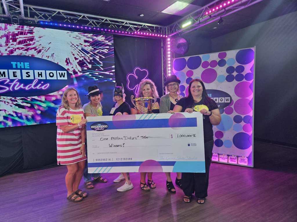 🎬✨ Over the summer, a group of our high school staff enjoyed an evening of fun and team bonding at The Game Show Experience in the Twin Cities!  They got the chance to step into a Hollywood-inspired game show studio and take part in an immersive world of laughter, challenges, and team spirit. 🎤🎉  We love seeing our staff come together outside of school—it makes our Panther team even stronger! 🐾💜  #PantherPride #TeamECSD #GameShowExperience