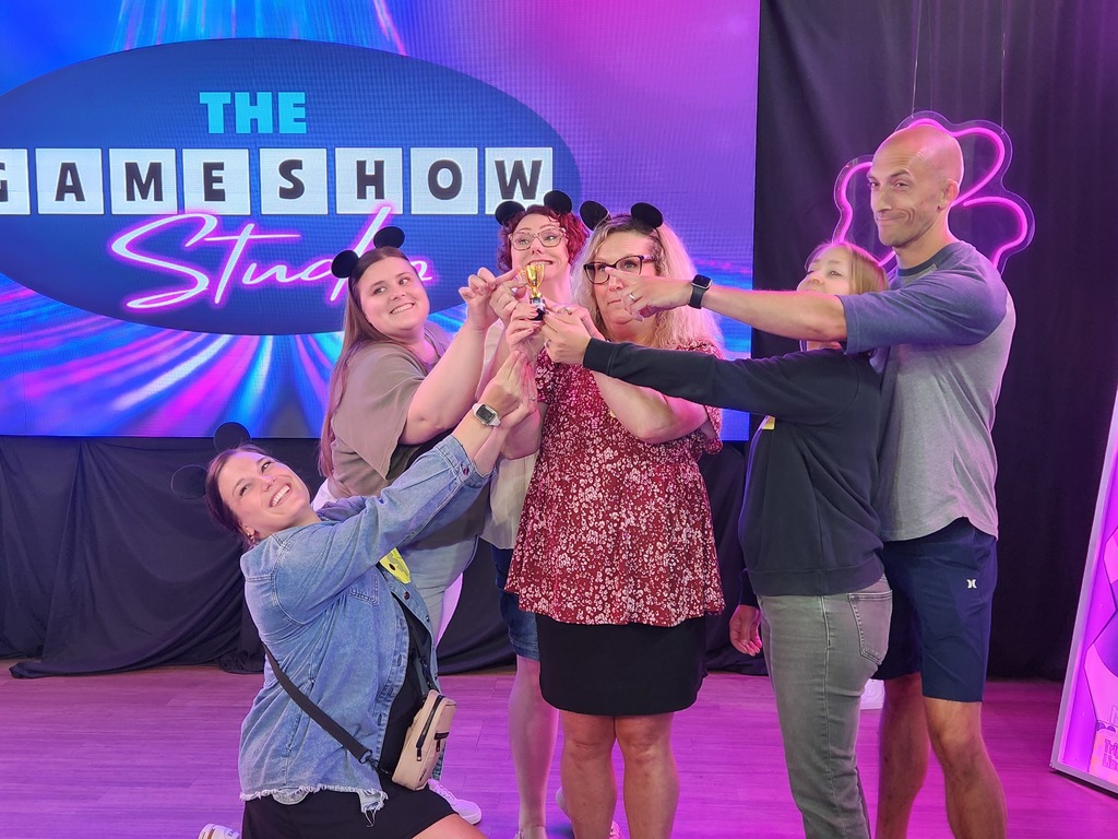 🎬✨ Over the summer, a group of our high school staff enjoyed an evening of fun and team bonding at The Game Show Experience in the Twin Cities!  They got the chance to step into a Hollywood-inspired game show studio and take part in an immersive world of laughter, challenges, and team spirit. 🎤🎉  We love seeing our staff come together outside of school—it makes our Panther team even stronger! 🐾💜  #PantherPride #TeamECSD #GameShowExperience