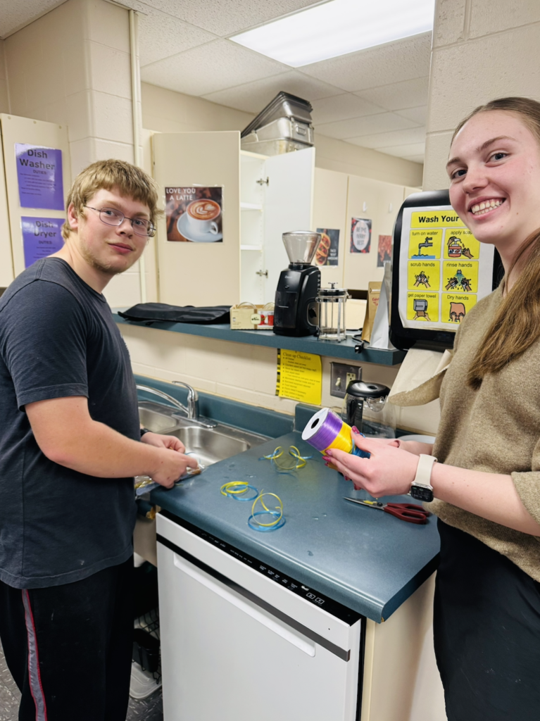 On October 19, the Ellsworth Hearts & Minds group completed another successful shipment of school supplies and comfort items to Ukraine, this time to a school in Radomyshl', located in the region of Zhytomyr Oblast in north-central Ukraine, about 70 miles west of Kyiv. After months of dedicated fundraising, the Hearts & Minds students raised enough money to purchase the supplies and cover shipping costs. With help from Day of Service volunteers, supplies were packaged. With the help of Ryan, my dad, Tom Benson, and his wife, Valentyna—who is from Radomyshl—19 boxes were labeled and shipped, each one carrying the compassion, encouragement, and hope of an entire school community reaching across the world.