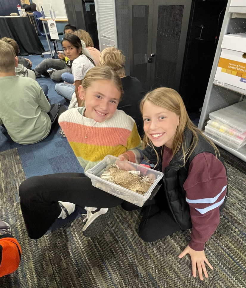 Fourth graders just wrapped up their Unit 1 in science, where they explored animal structures and how animals use these features to gather information from their environment in order to get food and protect themselves. As an extension of their learning, they had the exciting opportunity for Snake Discovery to visit and present to them. Fourth graders participated in their “Snake, Rattle, and Roll” program. The presentation focused on the reptiles and amphibians that call Minnesota and Wisconsin home. Students had the chance to watch a salamander eat, touch shredded skin, and even hold a large snake for a truly hands on experience! 🐍🦎