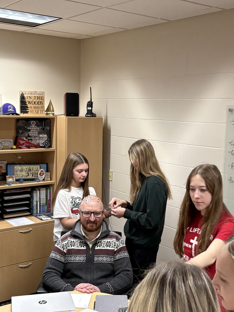 Talk about being good sports! 😄✨  At EMS, we celebrated WinterFest today before kicking off our holiday break, and one group of 8th grade girls had a very creative way to spread some school spirit. They earned the chance to bedazzle Principal Morrison, band director Mr. Morley, and our new PE teacher Mr. Campbell.  Thanks to these three for being such great sports and helping make WinterFest a memorable way to wrap up the semester! 💜❄️