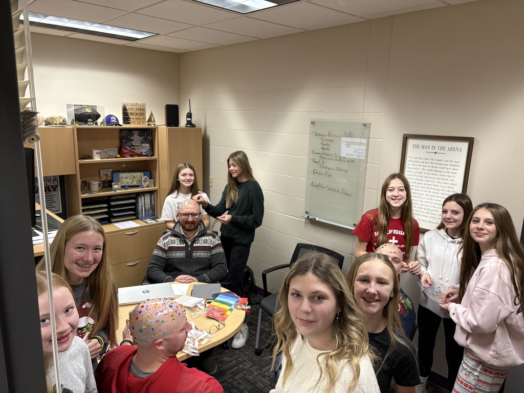 Talk about being good sports! 😄✨  At EMS, we celebrated WinterFest today before kicking off our holiday break, and one group of 8th grade girls had a very creative way to spread some school spirit. They earned the chance to bedazzle Principal Morrison, band director Mr. Morley, and our new PE teacher Mr. Campbell.  Thanks to these three for being such great sports and helping make WinterFest a memorable way to wrap up the semester! 💜❄️
