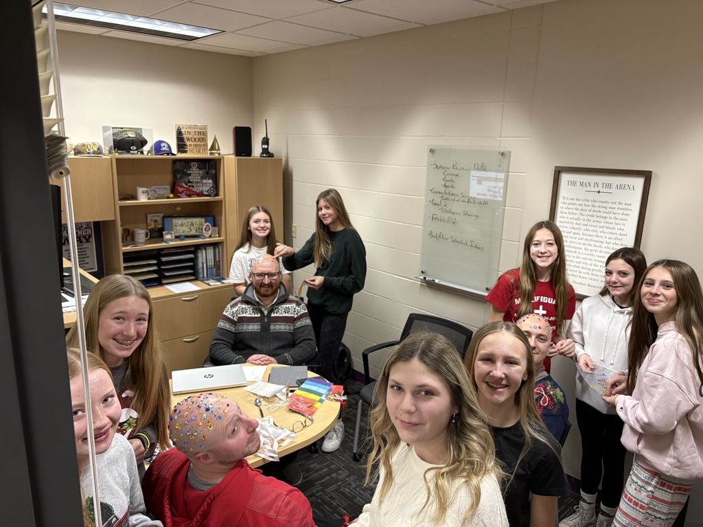 Talk about being good sports! 😄✨  At EMS, we celebrated WinterFest today before kicking off our holiday break, and one group of 8th grade girls had a very creative way to spread some school spirit. They earned the chance to bedazzle Principal Morrison, band director Mr. Morley, and our new PE teacher Mr. Campbell.  Thanks to these three for being such great sports and helping make WinterFest a memorable way to wrap up the semester! 💜❄️
